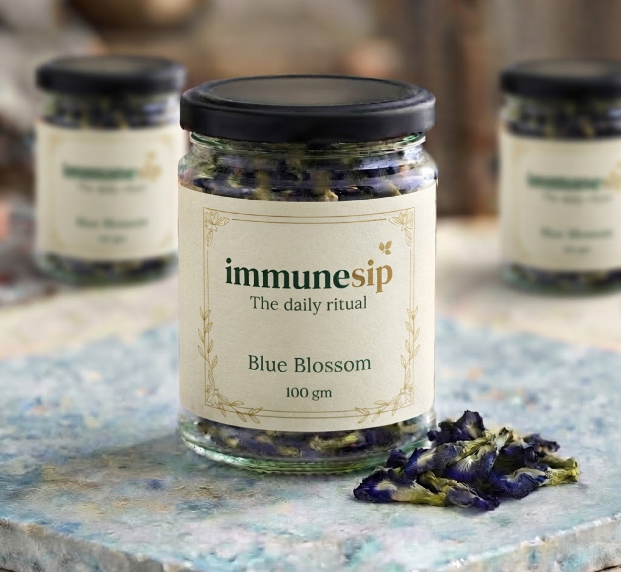 Blue Blossom in a clear glass jar with a black cap